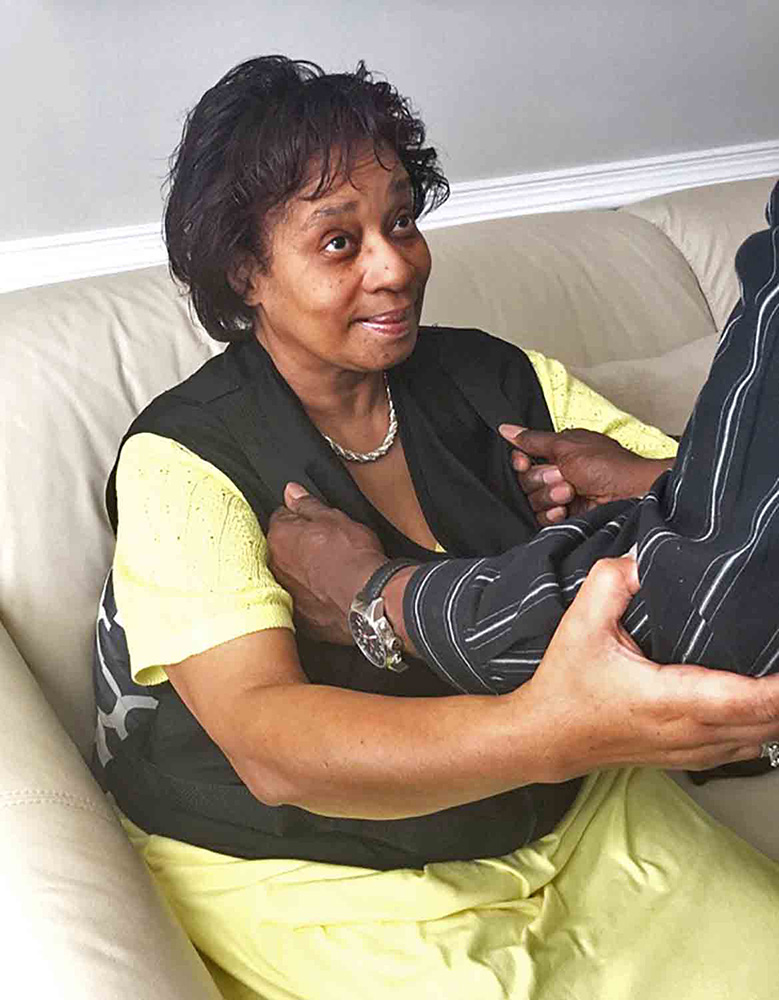 Caregiver using the EZ Lift Vest to safely assist a patient with ambulation